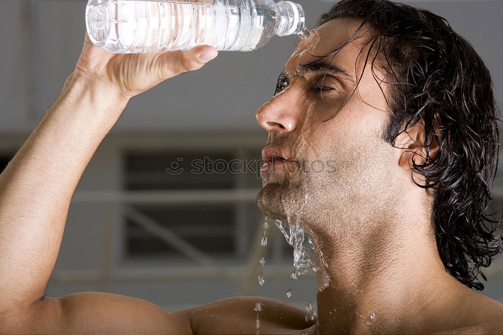 Similar – Young man drinking bottled water