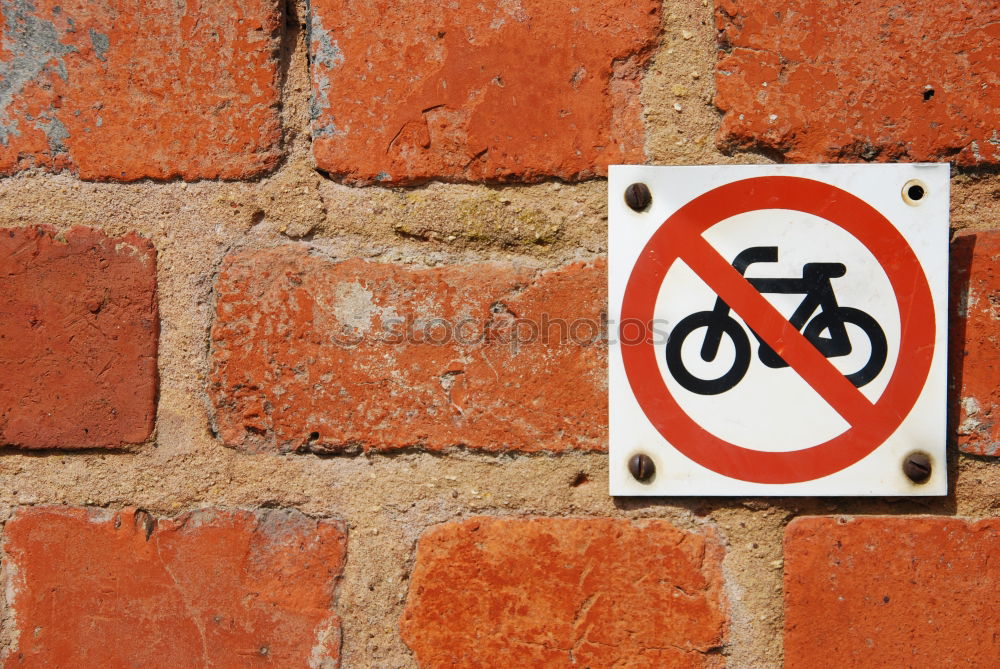 Similar – Signs I In front of a yellow house on the left and right side of the road there are traffic signs