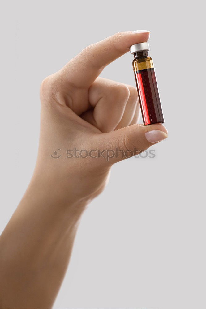 Similar – Female hand with red painted fingernails holding a bottle of red nail polish