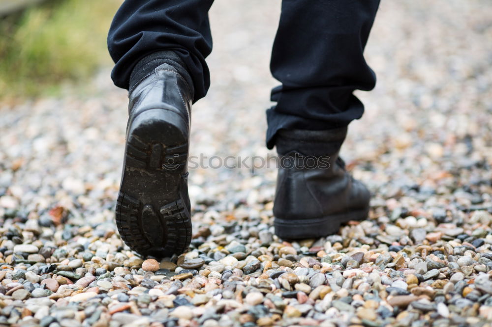 Similar – Image, Stock Photo Legs in leather boots in puddle