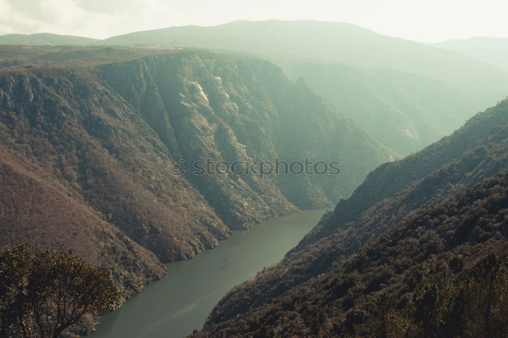 Similar – Image, Stock Photo Settlement in mountain valley