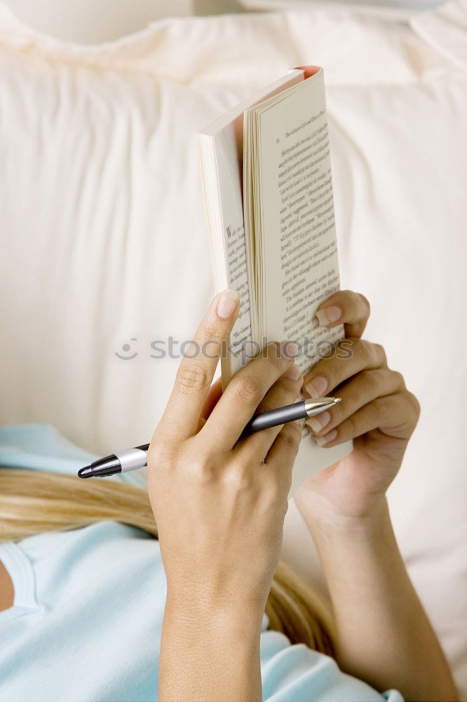 Similar – Young woman reading in her room