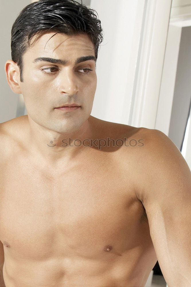 Similar – Young sexy pensive man sitting on bed