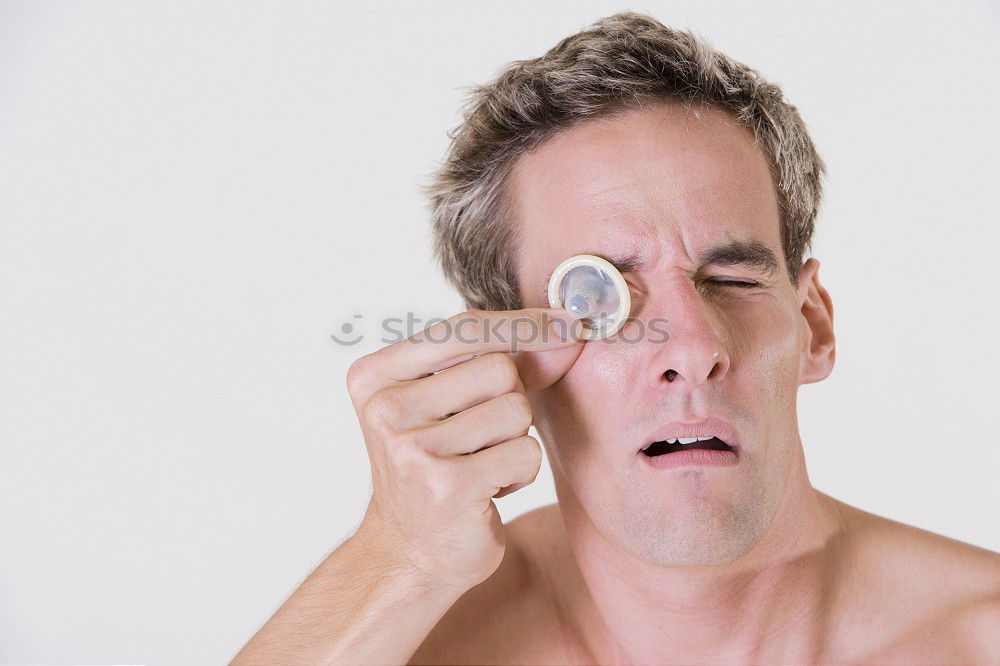 Similar – Woman with curlers and curd mask puts on make-up