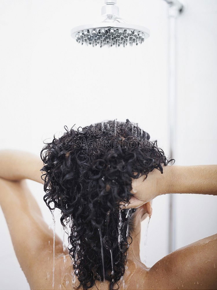 Similar – Woman shampooing her long brown hair