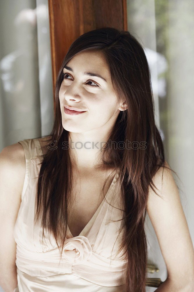 Girl with blue eyes smiling sitting on urban step