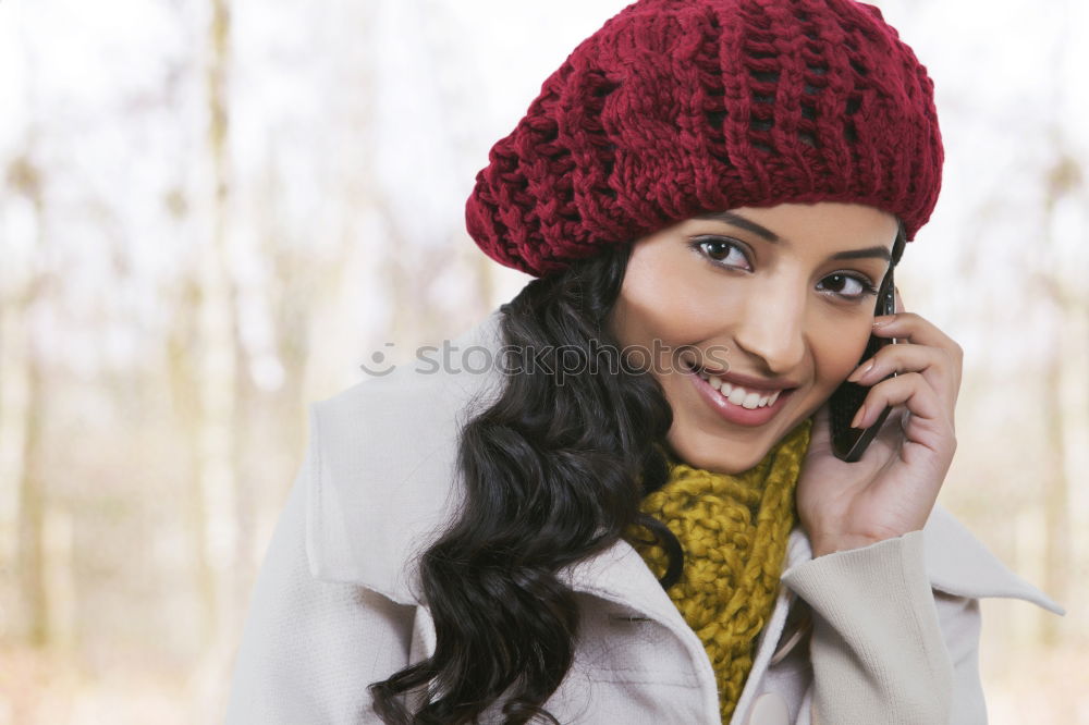 Similar – Smiling Woman in Autumn Fashion Talking on Phone