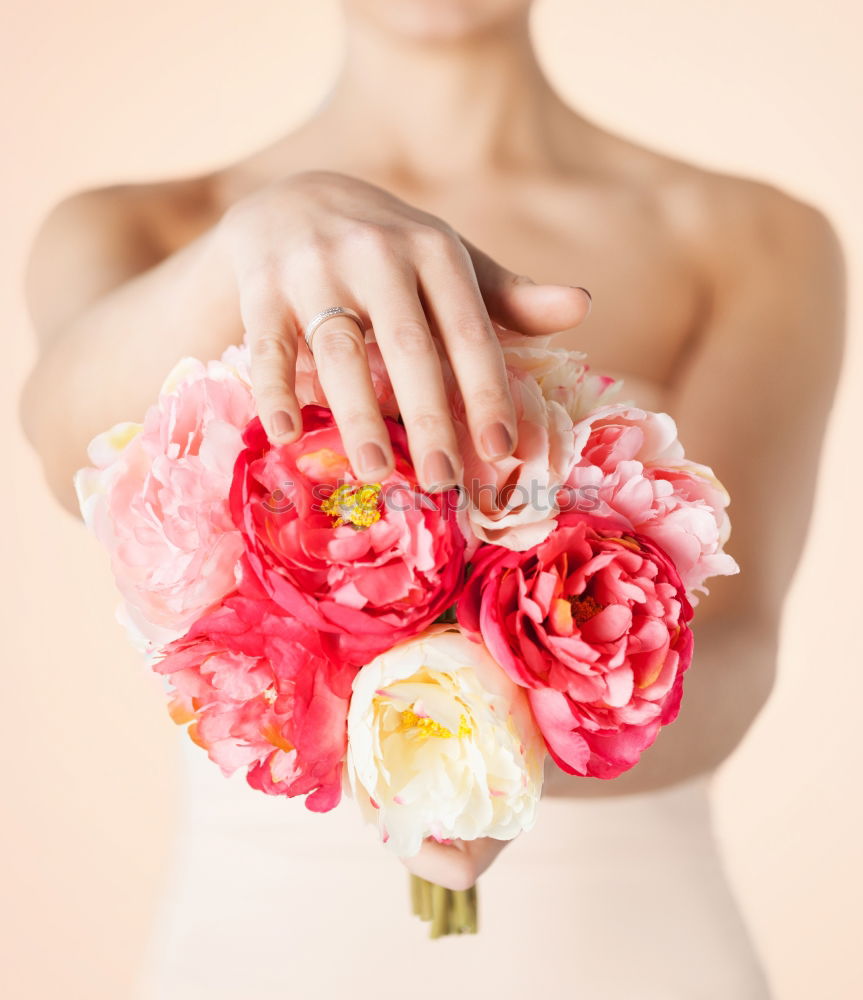 Similar – Young woman holding flowers in hand