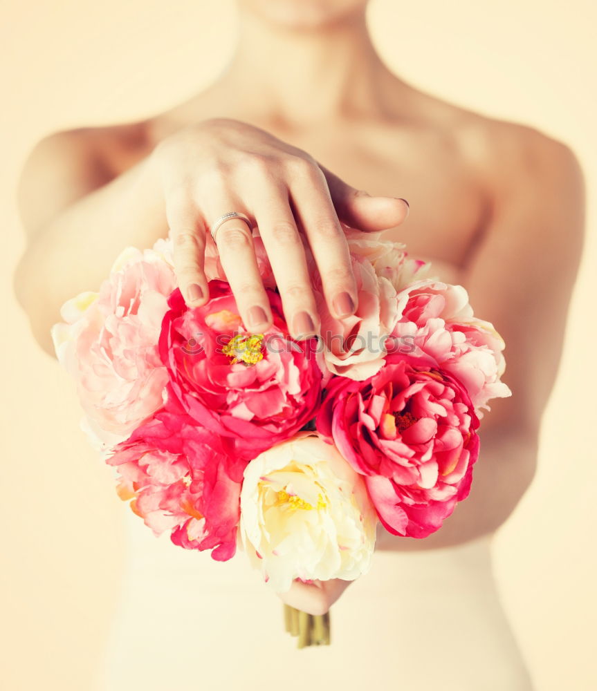 Similar – Young woman holding flowers in hand