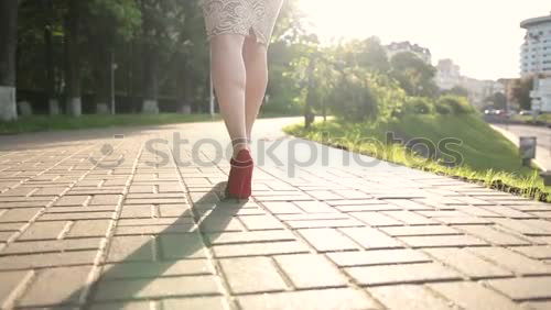 Similar – Image, Stock Photo Woman with long brunette waving hair and pink dress dancing barefoot on a large paved square against the light