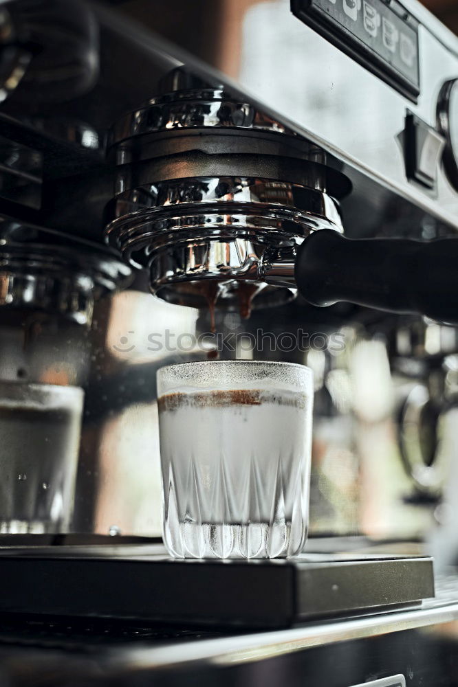 Similar – Preparation of a coffee with a barista coffee machine