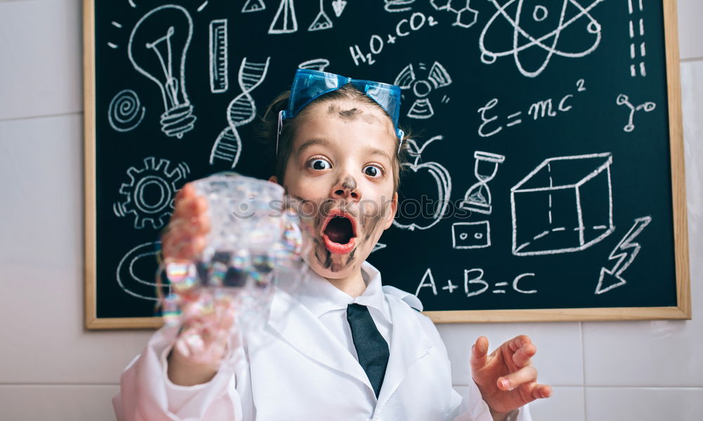 Similar – Child dressed as a scientist and chalkboard