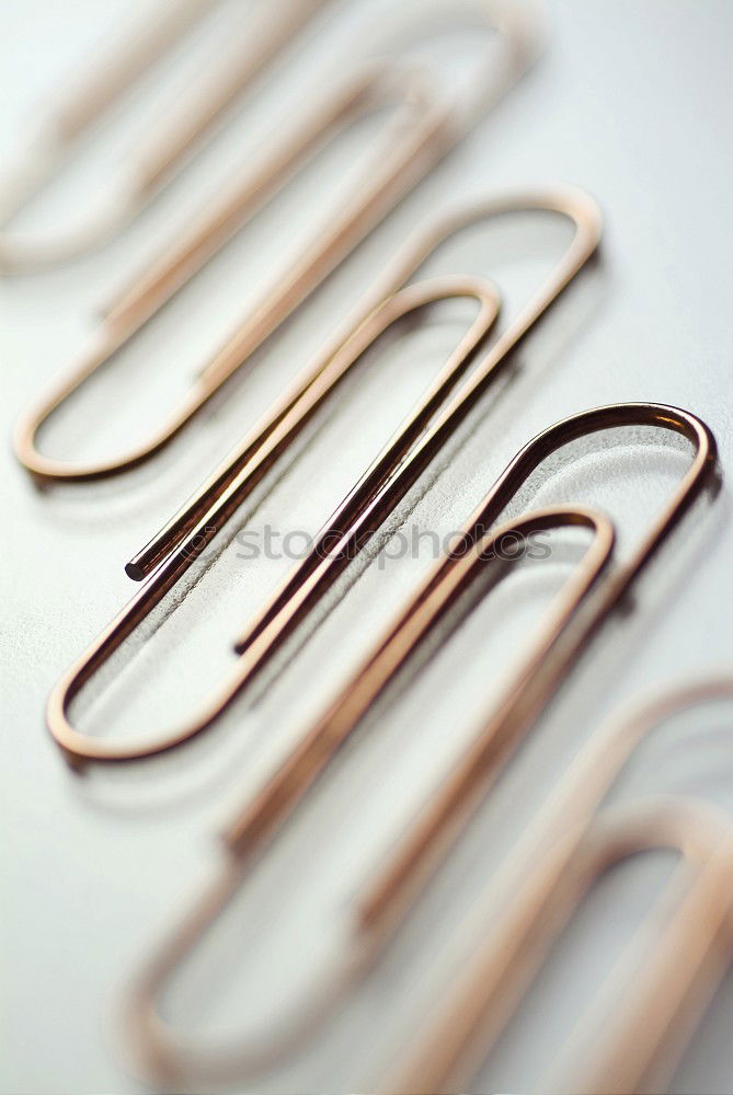 Similar – many paperclips on yellow background