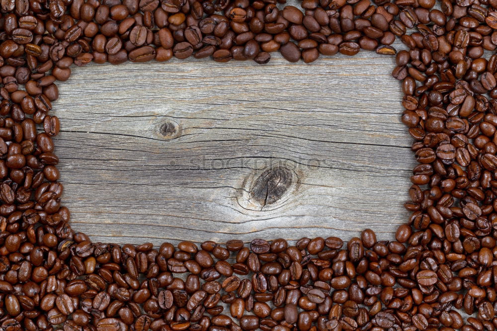 Similar – Coffee beans on wooden table background