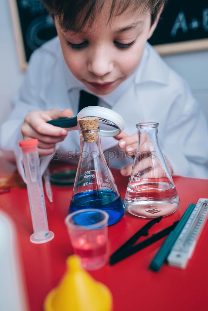 Similar – Image, Stock Photo Boy playing with chemistry game