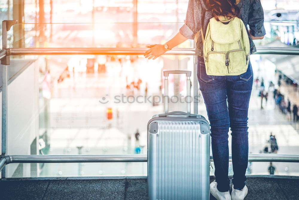 Similar – Image, Stock Photo Black Woman looking at the timetable information panel in the airport with a suitcase