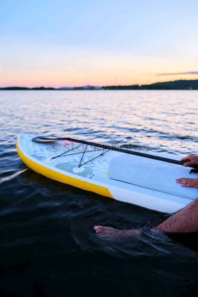 Similar – Unrecognizable traveler resting on kayak