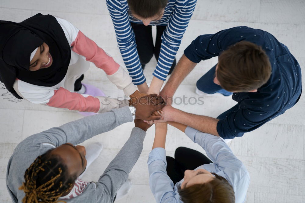 Similar – Image, Stock Photo Multiracial young people putting their hands together