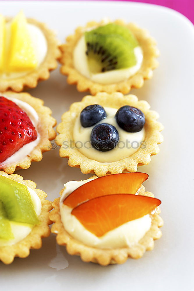 Similar – Delicious tartlets with raspberries and blueberries