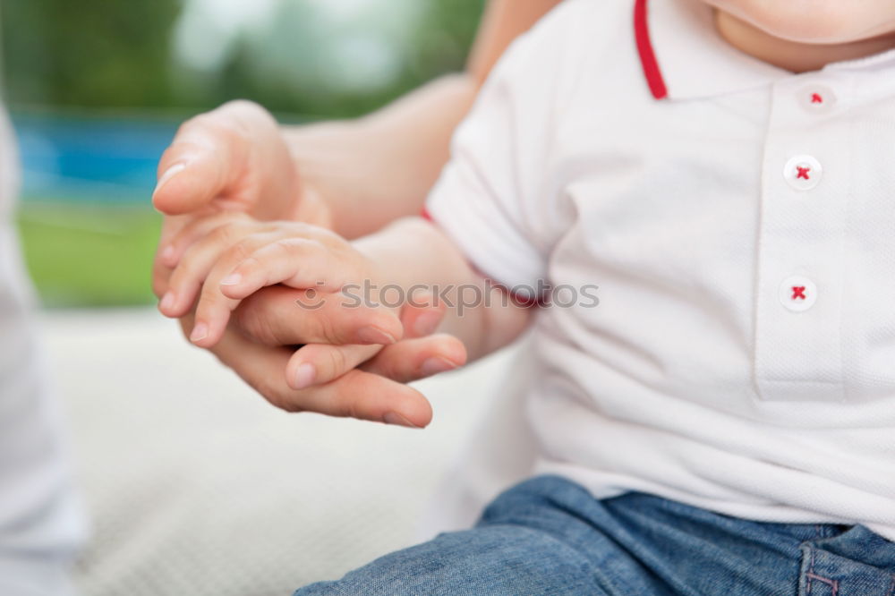 Similar – sad son hugging his dad near wall at the day time