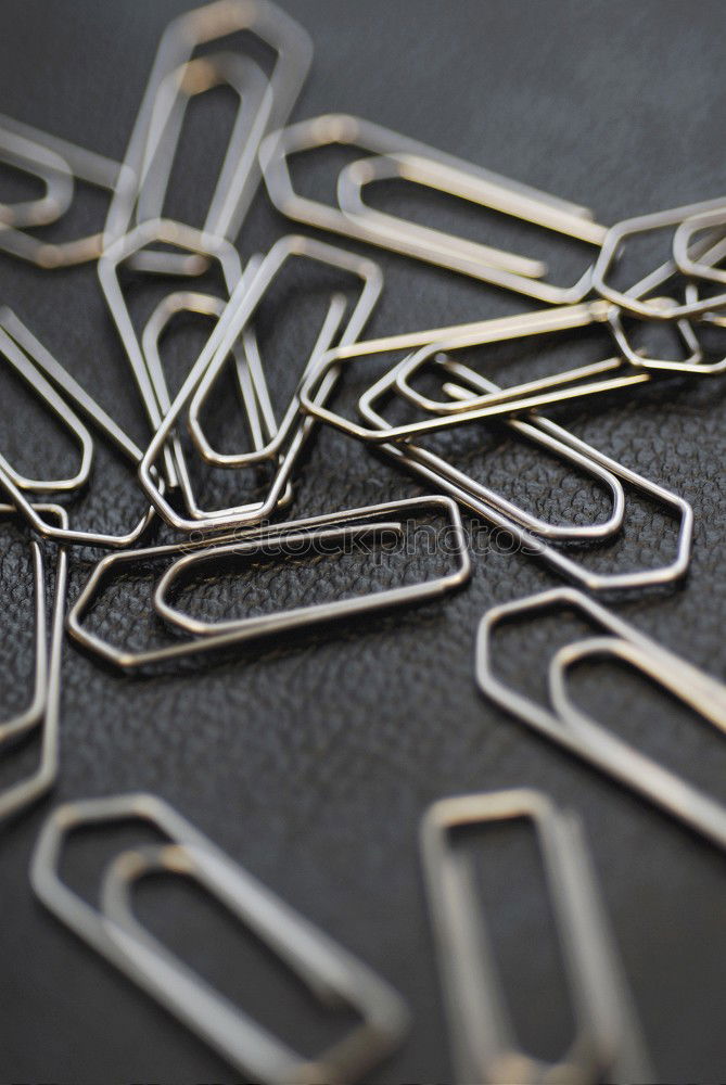 Similar – many paperclips on yellow background