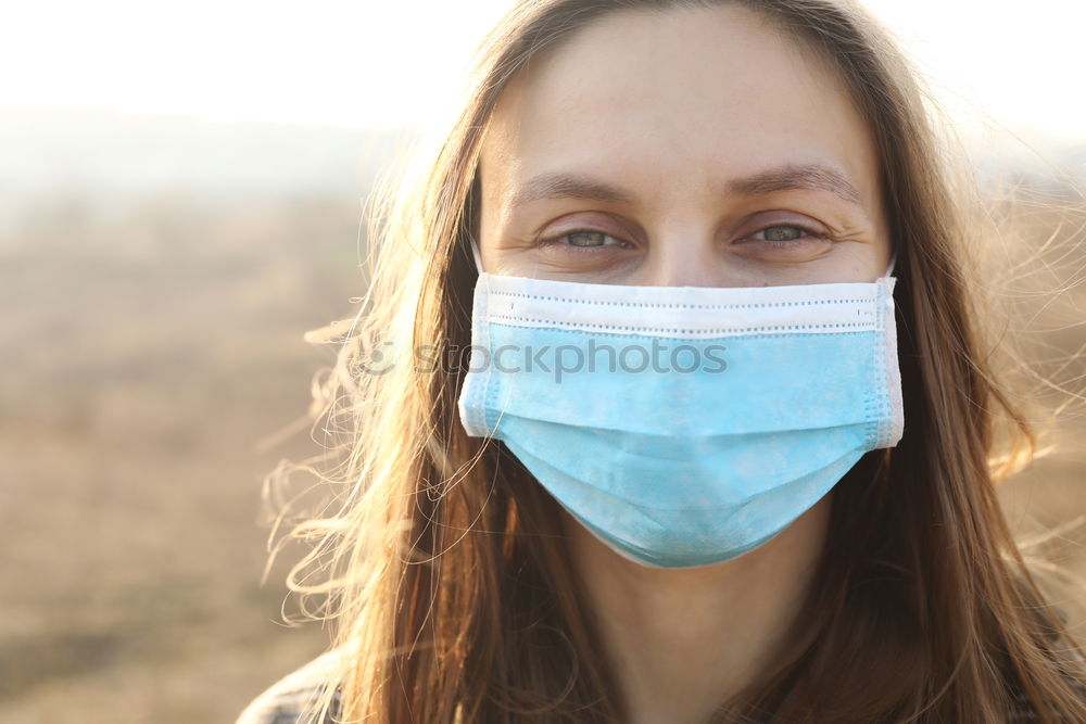 Similar – close up of Photo of a woman wearing protective mask against infectious diseases, coronavirus, covid-19 and flu outdoors. copy space. Coronavirus outbreak in Europe. Flu epidemic spread prevention