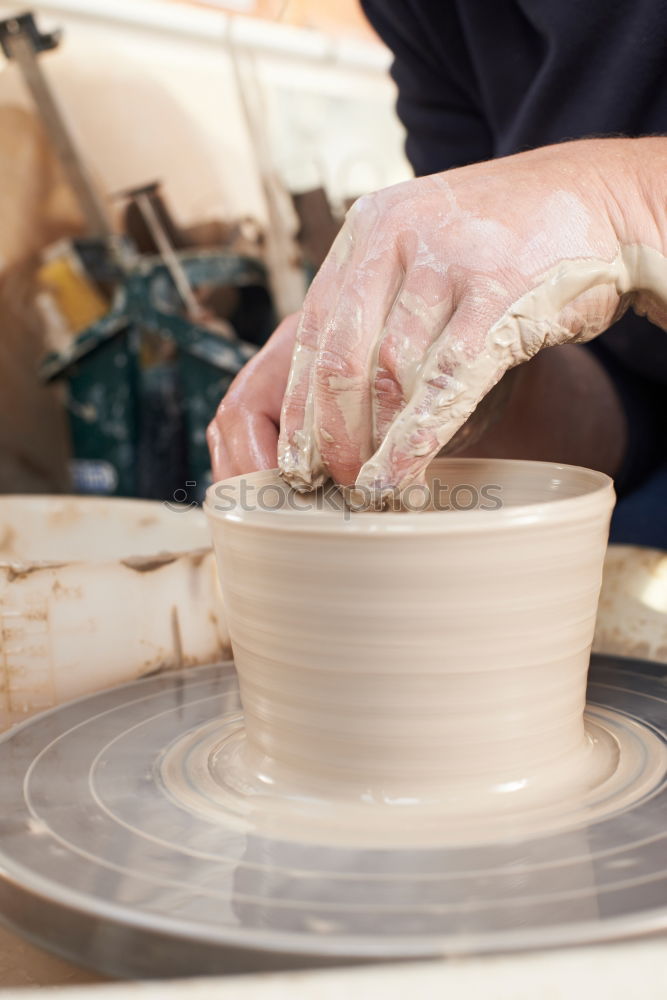 Similar – Female hands forming clay pot