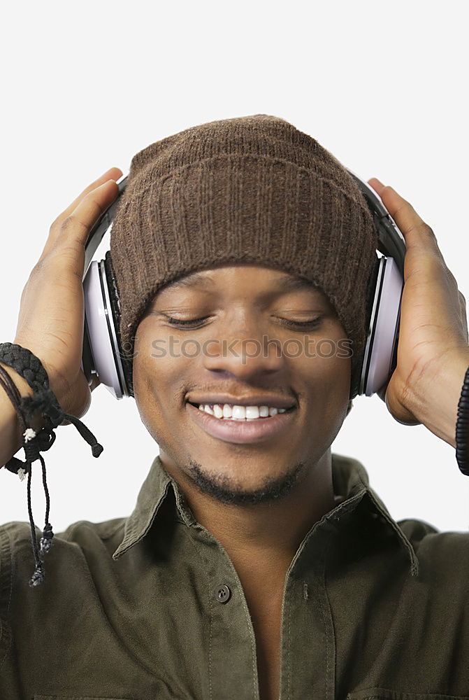 Similar – Black serious man listening to music in headphones