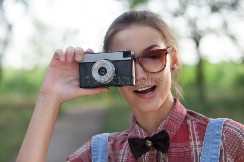 Similar – Image, Stock Photo Young woman taking pictures with an instant camera