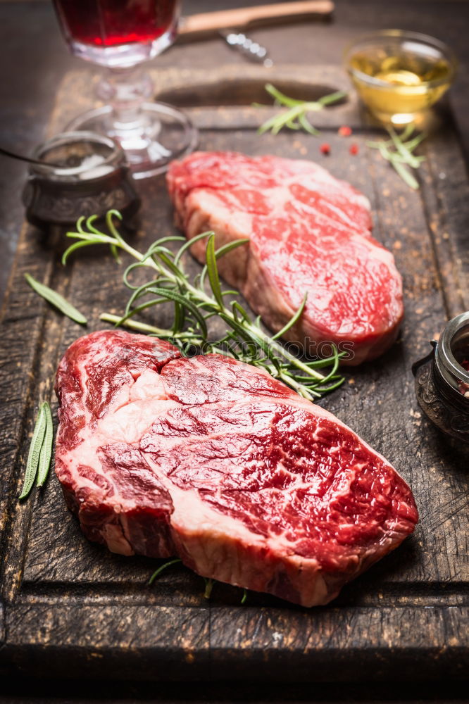 Similar – Image, Stock Photo Prepare steaks with herbs and butter