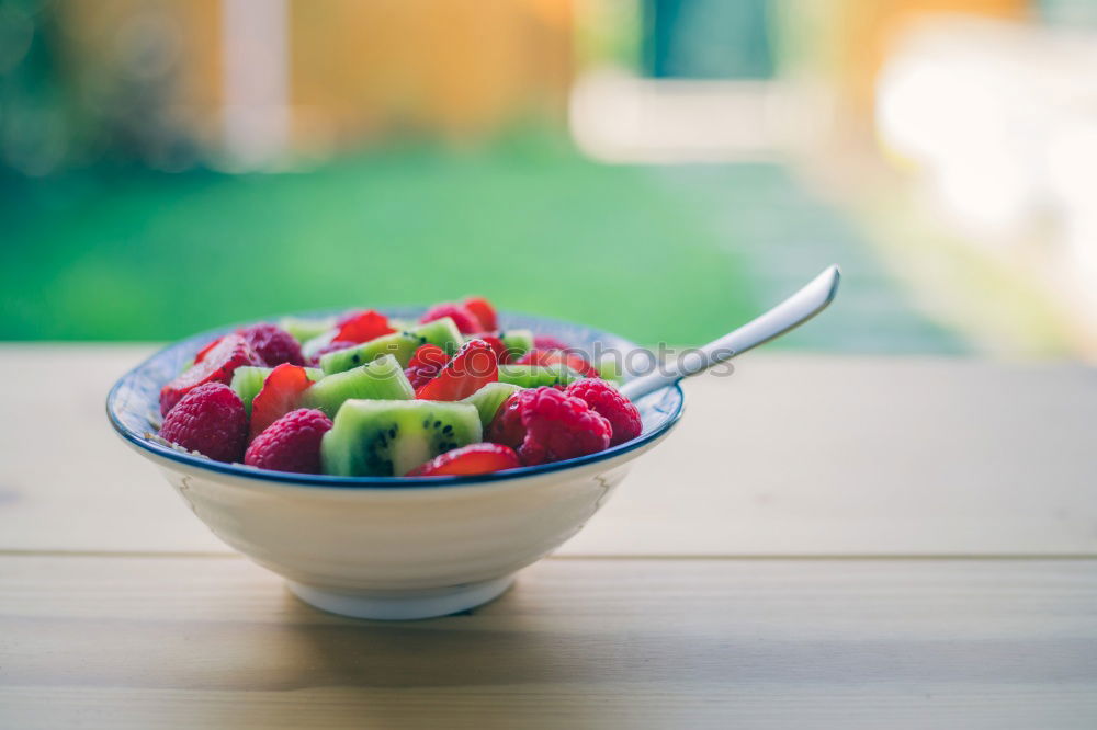 Similar – Image, Stock Photo Crop woman close up eating oat and fruits bowl for breakfast