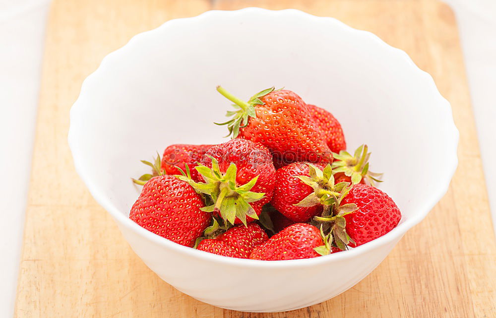 Similar – Strawberries in a bowl on an old wooden table