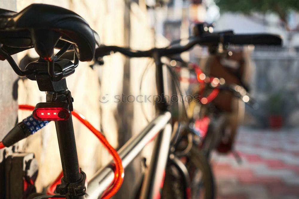 Similar – Image, Stock Photo the gloved man’s hand grabbed the bicycle after the repair at the frame and turned it around with power and momentum