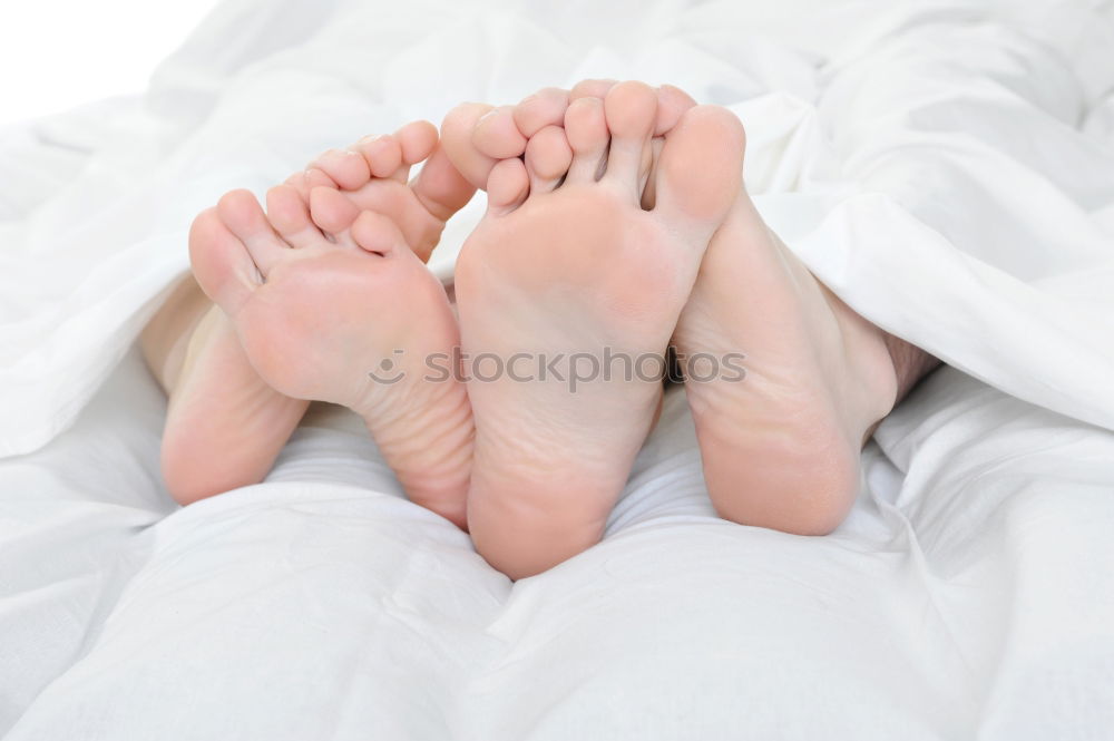 Similar – Happy children sitting on the bed barefoot.