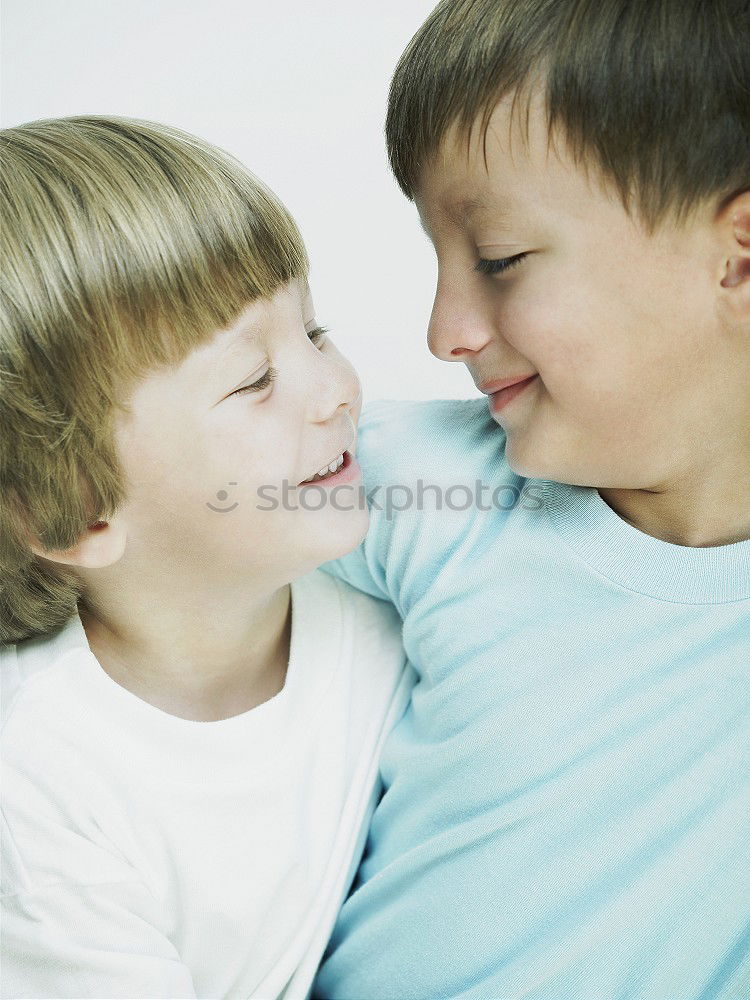 Similar – Brothers sitting at waterfront