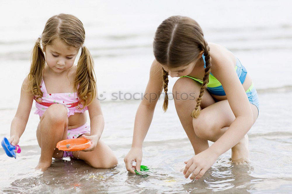 Similar – Two happy children playing on the beach