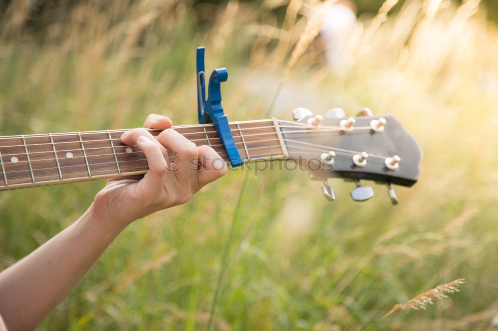 Similar – Beautiful woman playing guitar.