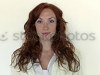 Similar – young beautiful redhead woman with curls and freckles smiles at camera