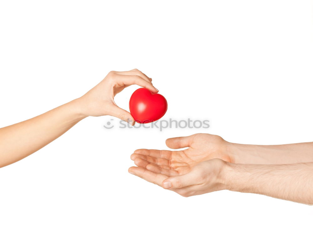 Similar – hands holding two oranges on gray background