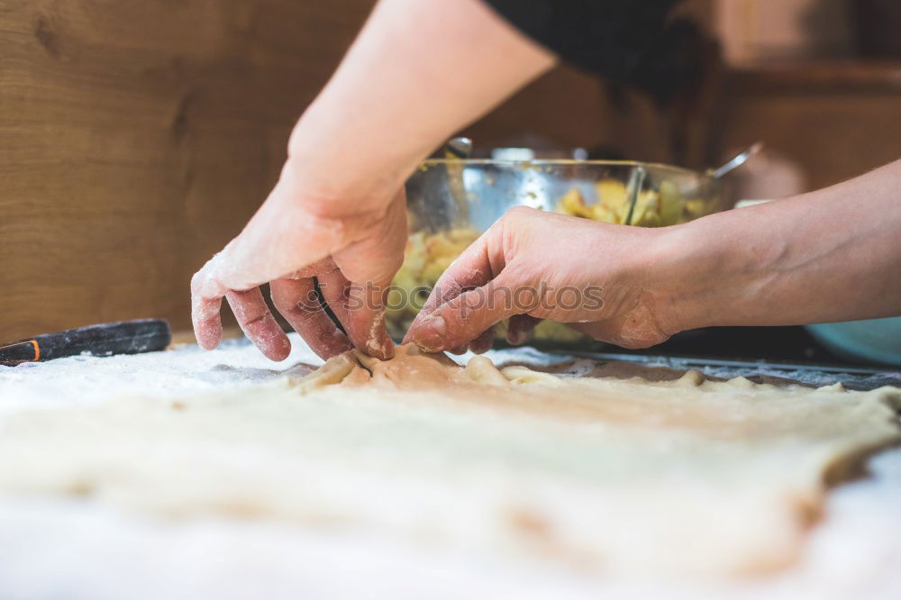 Similar – close up view of woman hand cutting nuts with knife