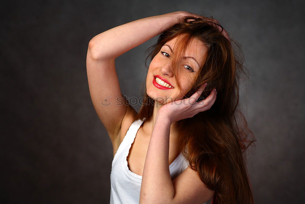 Similar – Cheerful brunette woman lying in grass