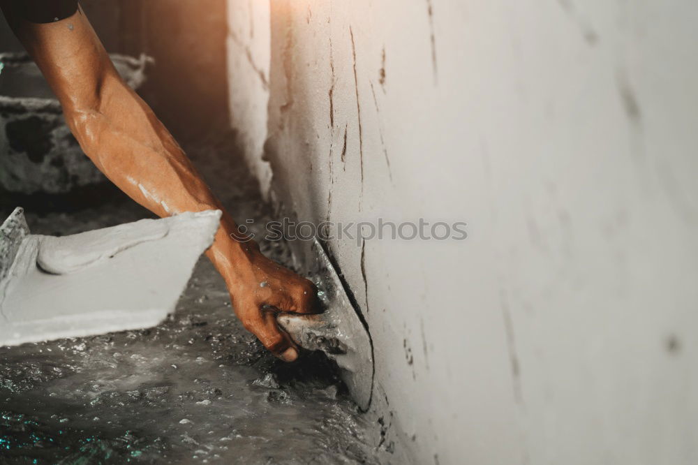 Similar – Female mason laying tiles on a terrace