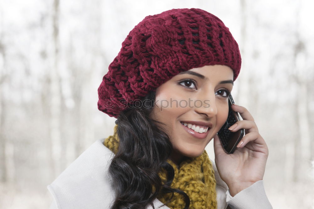 Similar – Smiling Woman in Autumn Fashion Talking on Phone