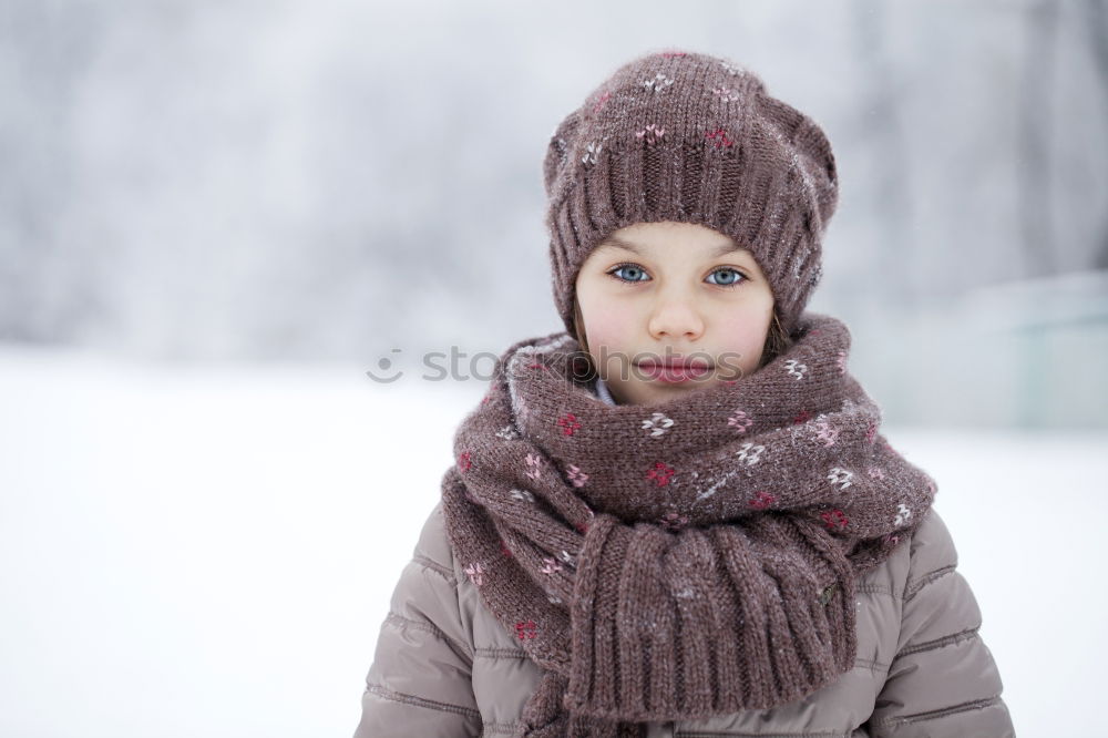 Similar – Child playing on the snow