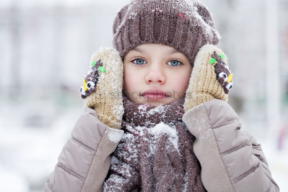 Similar – Child playing on the snow