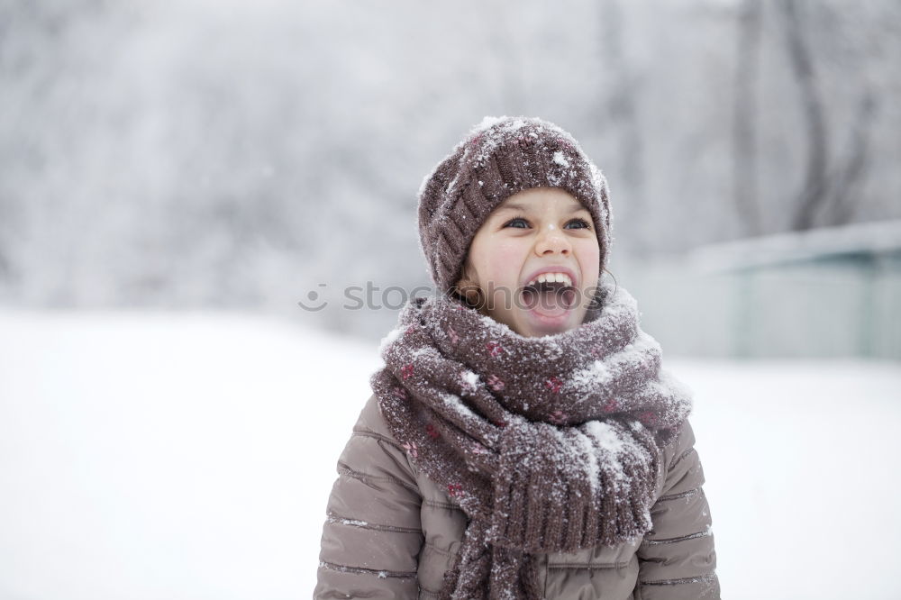 Similar – Image, Stock Photo Happy little girl enjoying snow. Child playing outdoors walking through deep snow in wintertime while snow falling. Toddler is wearing dark blue snowsuit