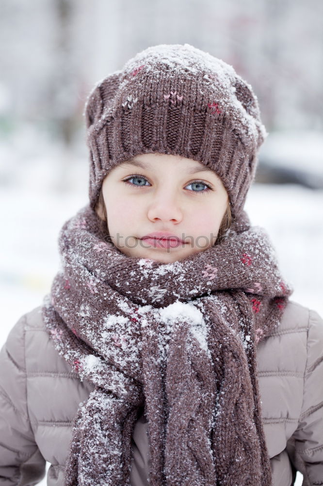 Similar – Child playing on the snow