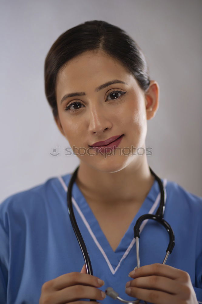 Similar – Smiling Female Doctor With Face Mask Wearing Scrubs In Busy Hospital During Health Pandemic