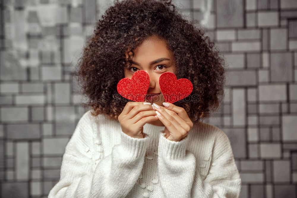 Similar – Image, Stock Photo Beautiful young woman holding a red heart