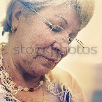 Similar – Image, Stock Photo Senior citizen looks at her smartphone in the autumn forest